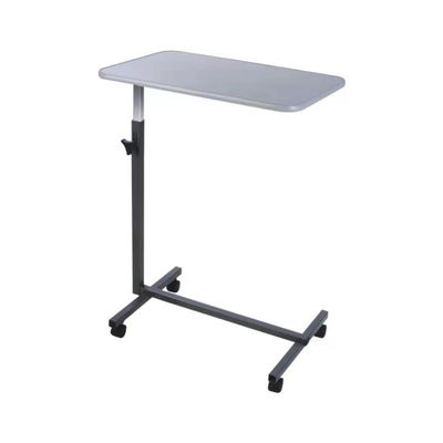 Tableau blanc de lit de Tray Table With Wheels Over de lit d'hôpital de patients